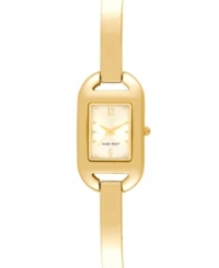 Sleek minimalism for everyday style from Nine West. Crafted of gold tone mixed metal bracelet and rectangular case. Champagne dial features gold tone dot markers, numerals at twelve and six o'clock, hour and minute hands, sweeping second hand and logo at six o'clock. Quartz movement. Limited lifetime warranty. Sleek minimalism for everyday style from Nine West. Crafted of gold tone mixed metal bracelet and rectangular case. Champagne dial features gold tone dot markers, numerals at twelve and six o'clock, hour and minute hands, sweeping second hand and logo at six o'clock. Quartz movement. Limited lifetime warranty.