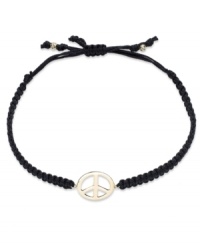 Give peace a chance! This trendy wrap bracelet features a 14k gold peace sign charm strung from a black nylon rope cord. Approximate diameter: 2-1/4 inches (extends to 3-1/2 inches). Give peace a chance! This trendy wrap bracelet features a 14k gold peace sign charm strung from a black nylon rope cord. Approximate diameter: 2-1/4 inches (extends to 3-1/2 inches).