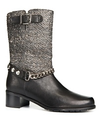 Stuart Weitzman's motorcycle boots are a study in contrasts, combining rock-and-roll leather and chains with refined tweed. Stuart Weitzman's motorcycle boots are a study in contrasts, combining rock-and-roll leather and chains with refined tweed.