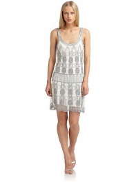 THE LOOKOrnate beadwork on sheer mesh overlayScoop necklineSleevelessPullover styleContrast under layerScalloped hemTHE FITAbout 38 from shoulder to hemTHE MATERIALPolyesterFully linedCARE & ORIGINDry cleanImportedModel shown is 5'11 (180cm) wearing US size Small. THE LOOKOrnate beadwork on sheer mesh overlayScoop necklineSleevelessPullover styleContrast under layerScalloped hemTHE FITAbout 38 from shoulder to hemTHE MATERIALPolyesterFully linedCARE & ORIGINDry cleanImportedModel shown is 5'11 (180cm) wearing US size Small.
