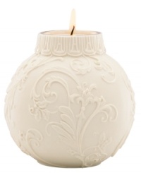 Embossed holly and scroll designs embellish this votive candle holder, perfect for adding a glow to your holiday table. From Lenox. Embossed holly and scroll designs embellish this votive candle holder, perfect for adding a glow to your holiday table. From Lenox.