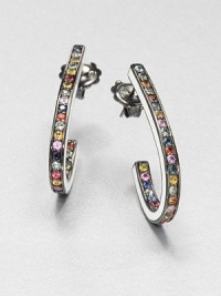 Elegant arcs set with a muted rainbow of sapphires are edged and backed with smooth enamel in this stunning yet simple design.SapphiresBlack rhodium-plated sterling silverLength, about 3Post backImported