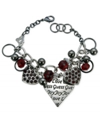 Even more to love. This charm bracelet from GUESS is crafted from silver-tone and hematite-tone mixed metal with heart charms featuring stunning Siam red stones. Item comes packaged in a signature GUESS Gift Box. Approximate length: 7-1/2 inches. Approximate drop: 1 inch. Approximate diameter: 1-1/2 inches. Even more to love. This charm bracelet from GUESS is crafted from silver-tone and hematite-tone mixed metal with heart charms featuring stunning Siam red stones. Item comes packaged in a signature GUESS Gift Box. Approximate length: 7-1/2 inches. Approximate drop: 1 inch. Approximate diameter: 1-1/2 inches.