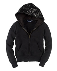 A classic full-zip hoodie is rendered in soft and warm cotton, tailored with raglan sleeves and updated with a stylish sequined hood. A classic full-zip hoodie is rendered in soft and warm cotton, tailored with raglan sleeves and updated with a stylish sequined hood.