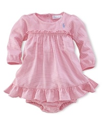 Dainty ruffles at the waist and hem add a hint of delicacy to a relaxed cotton dress and bloomer. Dainty ruffles at the waist and hem add a hint of delicacy to a relaxed cotton dress and bloomer.