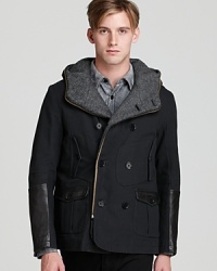 A smart mix of refined and sporty, this handsome coat features sleek leather details and unique pocket detailing to set your outdoor look apart. A smart mix of refined and sporty, this handsome coat features sleek leather details and unique pocket detailing to set your outdoor look apart.