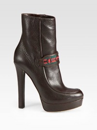 Leather ankle boot style with web detailing and a side zipper. Self-covered heel, 5½ (140mm)Self-covered platform, ¾ (20mm)Compares to a 4¾ heel (120mm)Leather and canvas upperSide zipperLeather lining and solePadded insoleMade in Italy Leather ankle boot style with web detailing and a side zipper. Self-covered heel, 5½ (140mm)Self-covered platform, ¾ (20mm)Compares to a 4¾ heel (120mm)Leather and canvas upperSide zipperLeather lining and solePadded insoleMade in Italy