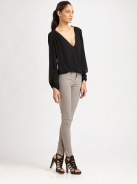 Styled with a breezy body, this silk blouse has gathered shoulders, long bishop sleeves and a plunging crossover v-neck. Crossover v-neckLong bishop sleevesElasticized cuffsLonger length hits below the hipsSilkDry cleanImportedModel shown is 5'10 (177cm) wearing US size Small. Styled with a breezy body, this silk blouse has gathered shoulders, long bishop sleeves and a plunging crossover v-neck. Crossover v-neckLong bishop sleevesElasticized cuffsLonger length hits below the hipsSilkDry cleanImportedModel shown is 5'10 (177cm) wearing US size Small.