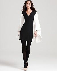 This RAOUL dress ushers in a decadent season with dramatic pleated sleeves and a chic color blocked body. Slip the statement piece over sheer tights for the ultimate in modern glamour. This RAOUL dress ushers in a decadent season with dramatic pleated sleeves and a chic color blocked body. Slip the statement piece over sheer tights for the ultimate in modern glamour.