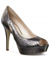 Slither your way into great style with the Tumble Peep Toe Pumps from Marc Fisher. A stunning snakeskin print covers this sleek design while unique side cut-outs add extra va va voom.