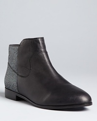 Get set to sparkle in these Rebecca Minkoff Chelsea booties, with glittering accents bringing up the rear. Get set to sparkle in these Rebecca Minkoff Chelsea booties, with glittering accents bringing up the rear.