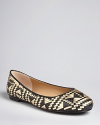 Woven metallic against a bold backdrop adds dynamic interest to a streamlined ballet flat silhouette by designer Rebecca Minkoff. Woven metallic against a bold backdrop adds dynamic interest to a streamlined ballet flat silhouette by designer Rebecca Minkoff.