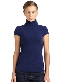 THE LOOKLuxe 2-ply cashmere from expertly maintained inner Mongolian cashmere goatsFeatures long, fine, smooth fibers top-dyed for maximum color saturationTurtleneck with ruched back detailRibbed cuff cap sleevesRuched sides Ribbed hemTHE FITAbout 23 from shoulder to hemTHE MATERIALCashmereCARE & ORIGINDry cleanImportedModel shown is 5'10 (177cm) wearing US size Small. THE LOOKLuxe 2-ply cashmere from expertly maintained inner Mongolian cashmere goatsFeatures long, fine, smooth fibers top-dyed for maximum color saturationTurtleneck with ruched back detailRibbed cuff cap sleevesRuched sides Ribbed hemTHE FITAbout 23 from shoulder to hemTHE MATERIALCashmereCARE & ORIGINDry cleanImportedModel shown is 5'10 (177cm) wearing US size Small.
