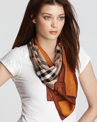 Classic camel check print and a buckle printed border accent this luxurious square silk scarf from Burberry. Classic camel check print and a buckle printed border accent this luxurious square silk scarf from Burberry.