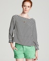 Get all decked out in an Alice + Olivia boat neck top in a luxe stretch silk with boldly patterned stripes.