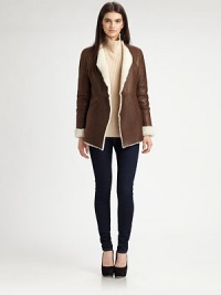Sleek lambskin finished soft shearling lining, all in a sleek open-front silhouette.Foldover lapelsLong sleevesOpen frontWelt pocketsAbout 29 from shoulder to hemDyed lamb shearlingDry clean by a fur specialistImportedFur origin: SpainModel shown is 5'9½ (176cm) wearing US size Small. Sleek lambskin finished soft shearling lining, all in a sleek open-front silhouette.Foldover lapelsLong sleevesOpen frontWelt pocketsAbout 29 from shoulder to hemDyed lamb shearlingDry clean by a fur specialistImportedFur origin: SpainModel shown is 5'9½ (176cm) wearing US size Small.