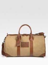 Prepare for your next weekend adventure with this lightweight, roomy classic duffel of cotton canvas trimmed in smooth leather.Zip closureTop handlesRemovable shoulder strapInterior zip pocketCanvas19W x 11H x 10DImported Prepare for your next weekend adventure with this lightweight, roomy classic duffel of cotton canvas trimmed in smooth leather.Zip closureTop handlesRemovable shoulder strapInterior zip pocketCanvas19W x 11H x 10DImported