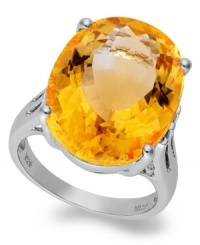 Richly colored with plenty of sparkle, this fun, bright ring features a dramatic oval-cut citrine (14-9/10 ct. t.w.) set in sterling silver. Size 7. Richly colored with plenty of sparkle, this fun, bright ring features a dramatic oval-cut citrine (14-9/10 ct. t.w.) set in sterling silver. Size 7.