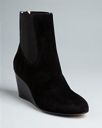 These Taryn Rose booties meet all the current fashion requirements, in a modern, streamlined design in luxurious suede. It's the hidden insoles-a hallmark of this orthopedic surgeon-turned-designer-that will have you wearing them around the clock. These Taryn Rose booties meet all the current fashion requirements, in a modern, streamlined design in luxurious suede. It's the hidden insoles-a hallmark of this orthopedic surgeon-turned-designer-that will have you wearing them around the clock.