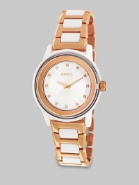 From the Orchestra Collection. Add a little sparkle with this Swarovski crystal accented timepiece. Quartz movementWater resistant to 10 ATMRound polycarbonate case, 40.5mm (1.6) Smooth rose goldtone ion-plated stainless steel bezelSilver dialSwarovski crystal hour markersRose goldtone ion-plated stainless steel and polycarbonate link braceletImported From the Orchestra Collection. Add a little sparkle with this Swarovski crystal accented timepiece. Quartz movementWater resistant to 10 ATMRound polycarbonate case, 40.5mm (1.6) Smooth rose goldtone ion-plated stainless steel bezelSilver dialSwarovski crystal hour markersRose goldtone ion-plated stainless steel and polycarbonate link braceletImported