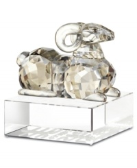 A Chinese symbol of affection among families, sheep have a place in any home. Crafted in smooth and faceted silvertone crystal, this Swarovski figurine features an authentic Asian design atop a base engraved with English and Chinese seal script. A Chinese symbol of affection among families, sheep have a place in any home. Crafted in smooth and faceted silvertone crystal, this Swarovski figurine features an authentic Asian design atop a base engraved with English and Chinese seal script.