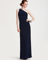 Opt for simple, modern elegance in this one-shoulder gown from Laundry by Shelli Segal. Sparkling beadwork decorates one side. Opt for simple, modern elegance in this one-shoulder gown from Laundry by Shelli Segal. Sparkling beadwork decorates one side.
