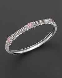 Pink crystal cushion stones decorative a timeless sterling silver bangle from Judith Ripka. Pink crystal cushion stones decorative a timeless sterling silver bangle from Judith Ripka.
