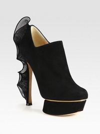 Runway-worthy suede design with an iconic sculpted platform and semi-sheer ruffled heel. Self-covered heel with taffeta ruffle, 5½ (140mm)Covered island platform, 1½ (40mm)Compares to a 4 heel (100mm)Suede upper with taffeta ruffle accentSide zipLeather lining and solePadded insoleMade in ItalyOUR FIT MODEL RECOMMENDS ordering one half size up as this style runs small. Runway-worthy suede design with an iconic sculpted platform and semi-sheer ruffled heel. Self-covered heel with taffeta ruffle, 5½ (140mm)Covered island platform, 1½ (40mm)Compares to a 4 heel (100mm)Suede upper with taffeta ruffle accentSide zipLeather lining and solePadded insoleMade in ItalyOUR FIT MODEL RECOMMENDS ordering one half size up as this style runs small.