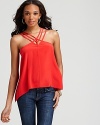 Featuring unique strap detail at the neckline, this silk BCBGMAXAZRIA top--rendered in a luscious berry hue--lends your denim collection luxurious appeal.