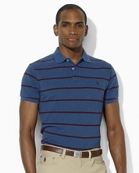 An iconic trim-fitting polo shirt in breathable cotton mesh features slim stripes and a subtle heathered effect for a cool, vintage quality. An iconic trim-fitting polo shirt in breathable cotton mesh features slim stripes and a subtle heathered effect for a cool, vintage quality.