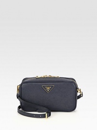 Crossbody design in saffiano leather with a front goldtone logo.Detachable adjustable shoulder strap, 21½-23½ dropTop zip closureOne inside zip pocketOne inside open pocketSignature jacquard lining8¾W X 4¾H X 2½DMade in Italy Crossbody design in saffiano leather with a front goldtone logo.Detachable adjustable shoulder strap, 21½-23½ dropTop zip closureOne inside zip pocketOne inside open pocketSignature jacquard lining8¾W X 4¾H X 2½DMade in Italy