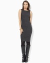 A timeless knit sheath dress is finished with faux-leather trim at the neckline for a modern edge.