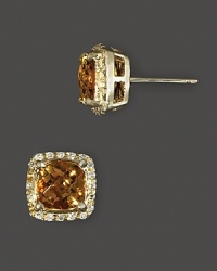 Diamonds frame faceted citrine, set in 14K yellow gold. Diamonds frame faceted citrine, set in 14K yellow gold.