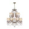 Glamour radiates from this medium-sized Ralph Lauren chandelabra, featuring eighteen bulbs topped with petite silk shades and draped with dazzling crystals.
