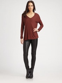 Long, lightweight v-neck has dropped shoulders, long dolman sleeves and a sultry v-back. V-neckDropped shouldersLong dolman sleevesV-backLonger length hits below the hipsRayonDry cleanImportedModel shown is 5'10 (177cm) wearing US size Small. Long, lightweight v-neck has dropped shoulders, long dolman sleeves and a sultry v-back. V-neckDropped shouldersLong dolman sleevesV-backLonger length hits below the hipsRayonDry cleanImportedModel shown is 5'10 (177cm) wearing US size Small.