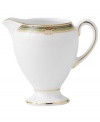 This enchanting pattern features a pale green border dotted with vivid red hues for your tabletop while shimmering gold accents add to the allure of this unique creamer. From the Wedgwood dinnerware and dishes collection.