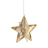 Formed of sparkling Swarovski crystal in a warm golden hue, this star-shaped ornament shines in bold dimension.
