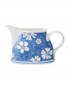 Vintage charm meets modern durability in the Farmhouse Touch creamer, featuring white laurels and blooms on cornflower-blue porcelain from Villeroy & Boch.