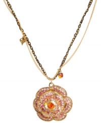 Radiant rose. Betsey Johnson's antique gold tone mixed metal necklace features a gold-tone rose pendant that's covered in ombre pave crystals. Gold-tone and black necklace chains add depth. Approximate length: 16 inches + 3-inch extender. Approximate drop: 1-3/4 inches. Radiant rose. Betsey Johnson's antique gold tone mixed metal necklace features a gold-tone rose pendant that's covered in ombre pave crystals. Gold-tone and black necklace chains add depth. Approximate length: 16 inches + 3-inch extender. Approximate drop: 1-3/4 inches.