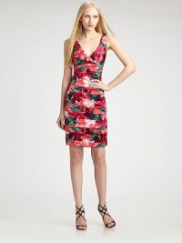 Island blooms accent a softly gathered and tucked style of stretch silk.Crossover v-neckline and back Invisible side zip closure 94% silk/6% spandex Polyester lining Dry clean Imported of Italian fabric Island blooms accent a softly gathered and tucked style of stretch silk.Crossover v-neckline and back Invisible side zip closure 94% silk/6% spandex Polyester lining Dry clean Imported of Italian fabric
