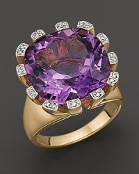 A spray of diamonds frames amethyst, set in 14K yellow gold. A spray of diamonds frames amethyst, set in 14K yellow gold.