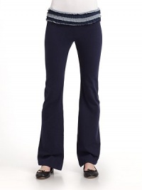 THE LOOKFoldover elastic waistband Alternating contrast and matching tiered ruffles on waistband Bootcut legTHE FITFitted through hip and thigh Inseam, about 32THE MATERIAL90% cotton/10% spandexCARE & ORIGINMachine wash Made in USA THE LOOKFoldover elastic waistband Alternating contrast and matching tiered ruffles on waistband Bootcut legTHE FITFitted through hip and thigh Inseam, about 32THE MATERIAL90% cotton/10% spandexCARE & ORIGINMachine wash Made in USA