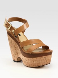 Adjustable, lustrous leather straps accompanied by a cork wedge and platform. Cork wedge with wooden insert, 5 (125mm)Cork platform with wooden insert, 2 (50mm)Compares to a 3 heel (75mm)Leather upperLeather lining and solePadded insoleImportedOUR FIT MODEL RECOMMENDS ordering one half size up as this style runs small. Adjustable, lustrous leather straps accompanied by a cork wedge and platform. Cork wedge with wooden insert, 5 (125mm)Cork platform with wooden insert, 2 (50mm)Compares to a 3 heel (75mm)Leather upperLeather lining and solePadded insoleImportedOUR FIT MODEL RECOMMENDS ordering one half size up as this style runs small.