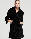 Evoke your animal instincts in a plush VINCE CAMUTO coat enlivened by an allover faux-fur outer.