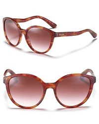 Glam it up in these rounded vintage-inspired frames by Miu Miu. Glam it up in these rounded vintage-inspired frames by Miu Miu.