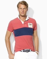 A short-sleeved, trim-fitting rugby is crafted from breathable cotton mesh with a pieced stripe and sporty patchwork for a modern, athletic look. A short-sleeved, trim-fitting rugby is crafted from breathable cotton mesh with a pieced stripe and sporty patchwork for a modern, athletic look.