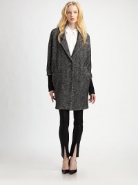 Sculptural and chic, tailored with menswear-inspired details and rendered in a bi-color cotton/wool blend tweed.Notched lapelsSnap front closuresThree-quarter sleevesSide welt pocketsFully linedAbout 35 from shoulder to hem60% cotton/40% woolDry cleanImportedModel shown is 5'10 (177cm) wearing US size Small. Sculptural and chic, tailored with menswear-inspired details and rendered in a bi-color cotton/wool blend tweed.Notched lapelsSnap front closuresThree-quarter sleevesSide welt pocketsFully linedAbout 35 from shoulder to hem60% cotton/40% woolDry cleanImportedModel shown is 5'10 (177cm) wearing US size Small.