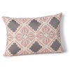 Cross-stitching and embroidery add color, texture and an earthy quality to this decorative pillow from JR by John Robshaw.
