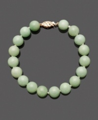 Green jade beads (10 mm) add a pale palette of color to your look. Pair this trendy beaded look with other stackable bracelets, or wear it alone for a subtle statement. Intricate clasp crafted in 14k gold. Approximate length: 7-1/2 inches.