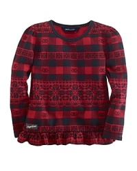A cozy cotton tunic adorned with a ruffled hem sports a unique plaid pattern. A cozy cotton tunic adorned with a ruffled hem sports a unique plaid pattern.